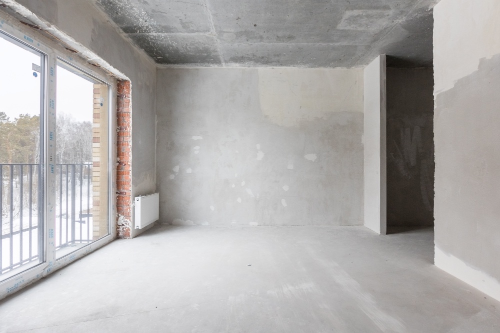 Empty room with large windows